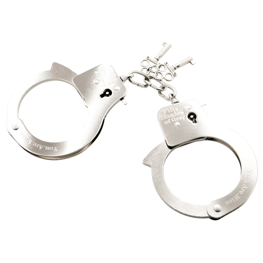 Catuse de Metal Fifty Shades of Grey You Are Mine - ideal pentru incepatori in explorarea jocurilor de bondage - include saculet din satin si 2 chei